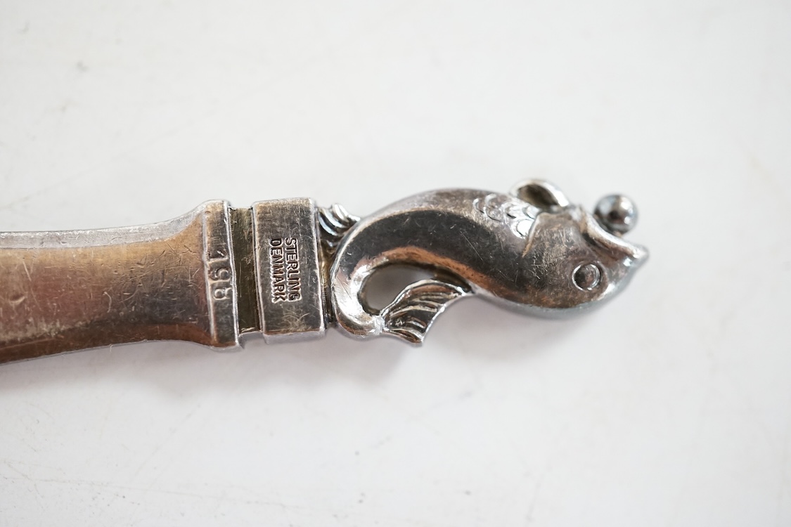 A 1960's Georg Jensen silver paperknife, design no.198, 11.5cm, with dolphin finial.